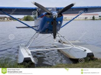 float-plane-cessna-blue-floats-sitting-lake-hood-alaska-97854731