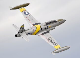 Gregory “Wired” Coyler pilots his Lockheed T-33 aircraft during the Arctic Thunder Special Needs and Family Day at Joint Base Elmendorf-Richardson, Alaska on July 29, 2016. The biennial event is historically the largest multi-day event in the state and one of the premier aerial demonstrations in the world. Arctic Thunder will open its doors to the public, featuring more than 40 key performers and ground acts, July 30 and 31. (U.S. Air Force photo/Alejandro Pena)